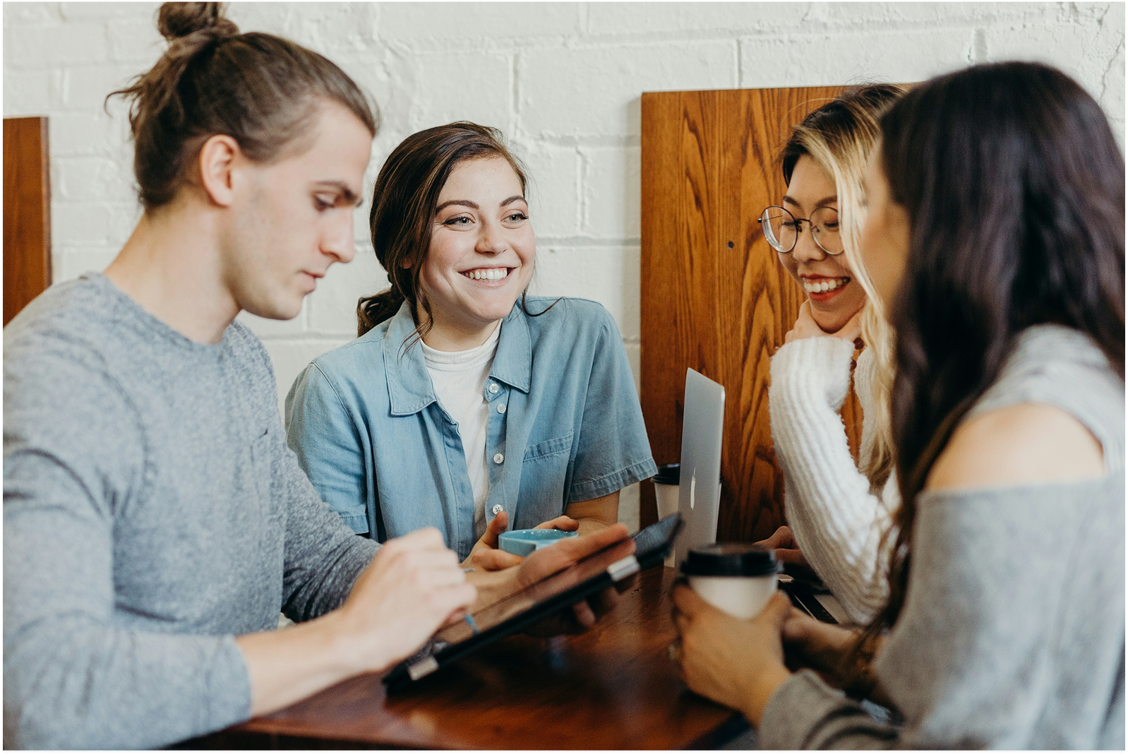 Team members collaborating in a bright meeting room