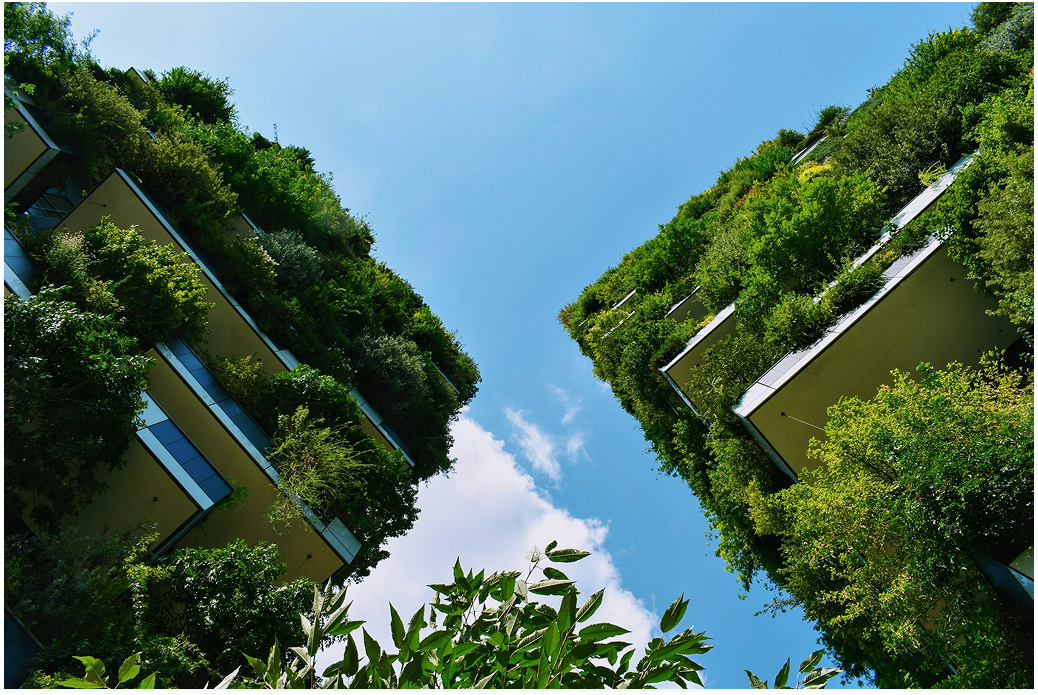 Green building facade seen from below